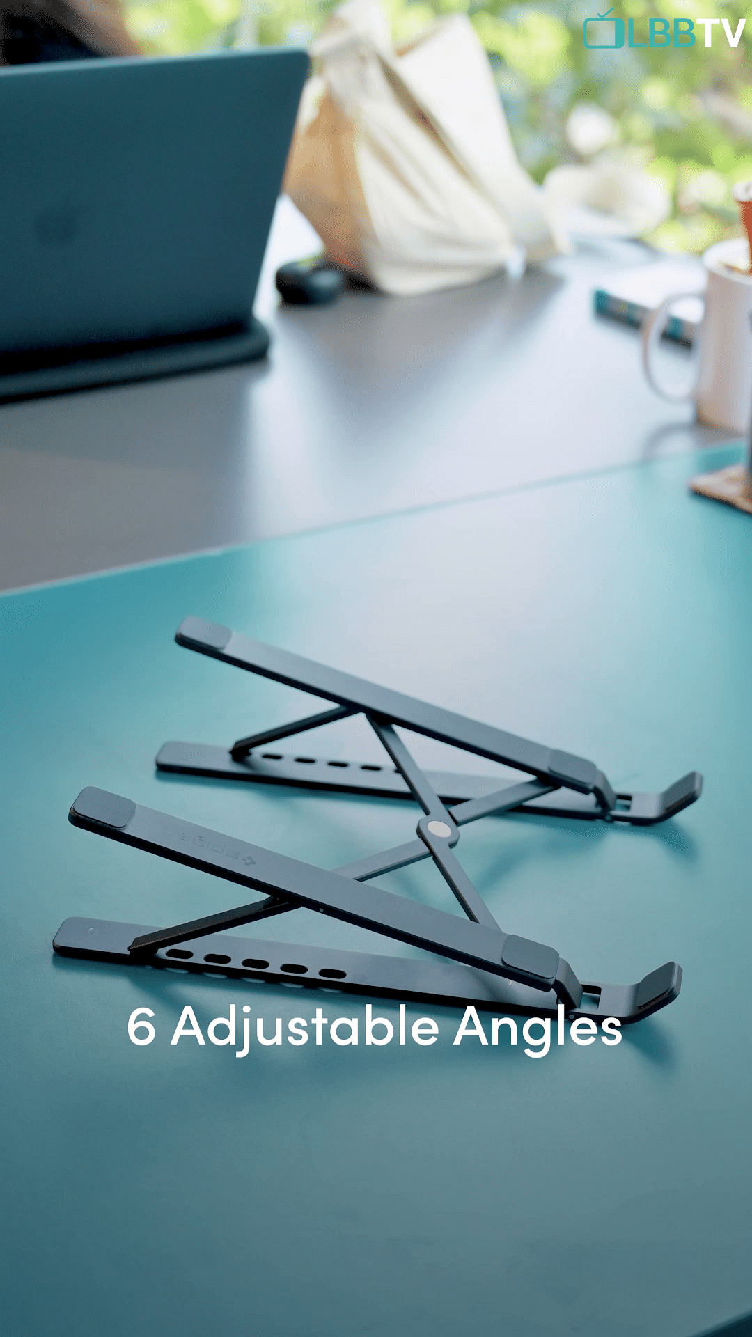 Glasses,Automotive design,Table,Eyewear,Laptop,Font,Wood,Electric blue,Triangle,Musical instrument accessory