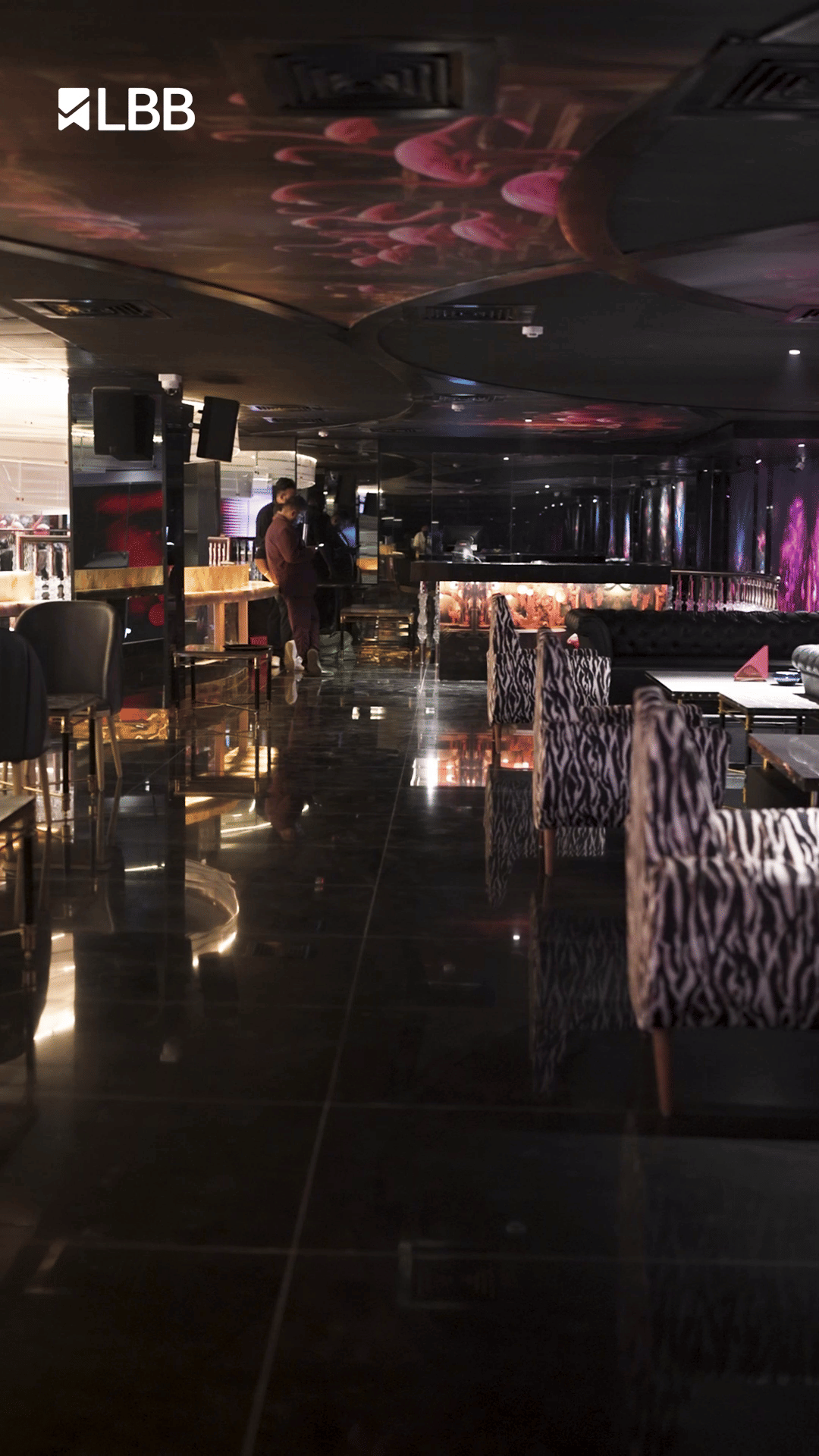 Chair,Building,Table,Flooring,Event,City,Barware,Sky,Darkness,Function hall