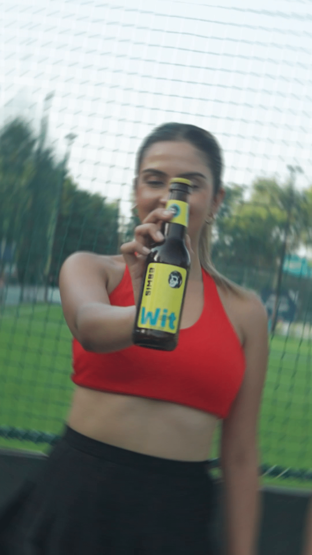 Active tank,Bottle,Water,Sky,Water bottle,Chest,Drink,Thigh,Exercise,Tree